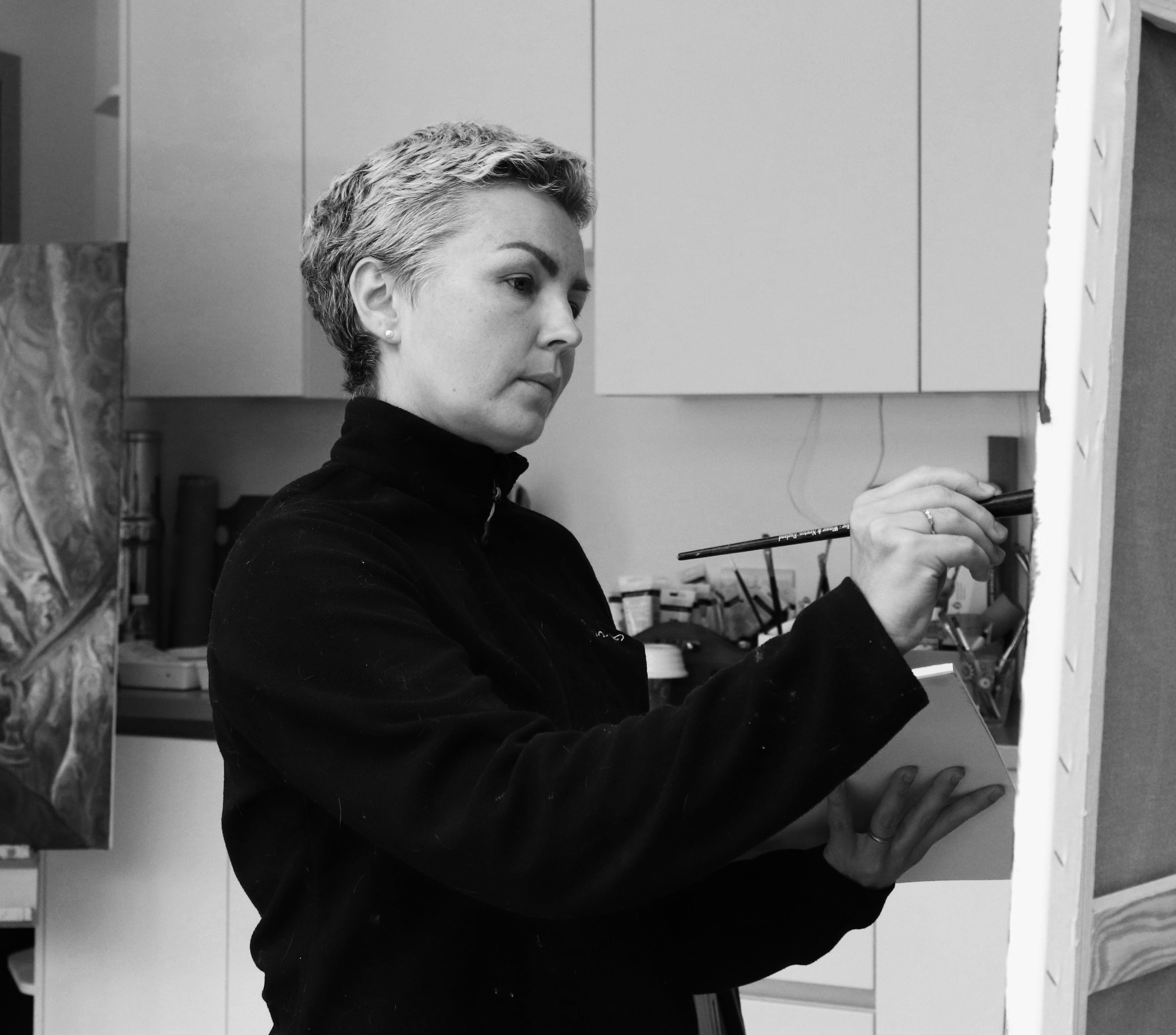 Marina Bowater painting in her studio